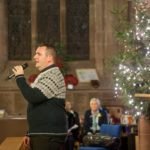 Singer Tom Clamp performing at Tamworth Co-op Christmas memorial service.