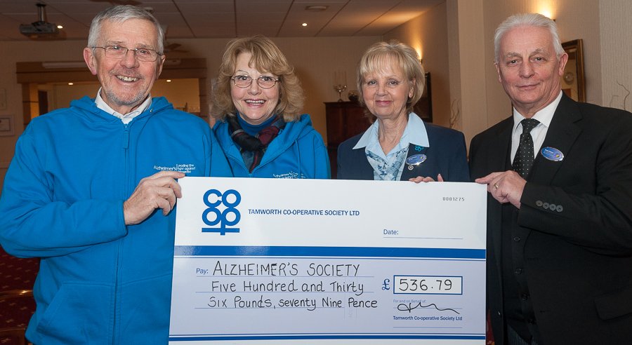 Alzheimer Society volunteers David and Margaret Barnes pictured at Tamworth Co-op’s funeral premises in Upper Gungate, receiving cheque for £536.79 from funeral staff Janice Chetwynd and Trevor Palmer.