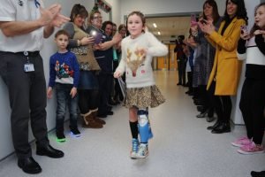 Amelia Eldred walking on her new artificial limb at Birmingham Children's Hospital. (Picture courtesy of Tamworth Herald).