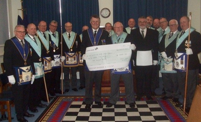 Acacia Freemasons Lodge members with cheque for firefighting equipment