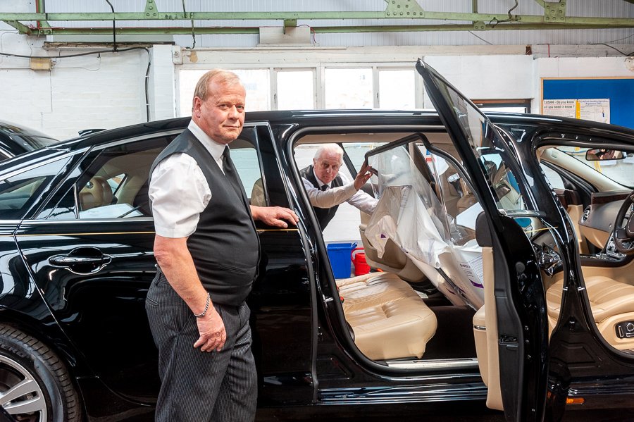 Funeral director Paul Warwick (left) and funeral co-ordinator Trevor Palmer pictured fitting a new safety screen in one of Tamworth Co-op's limousines.